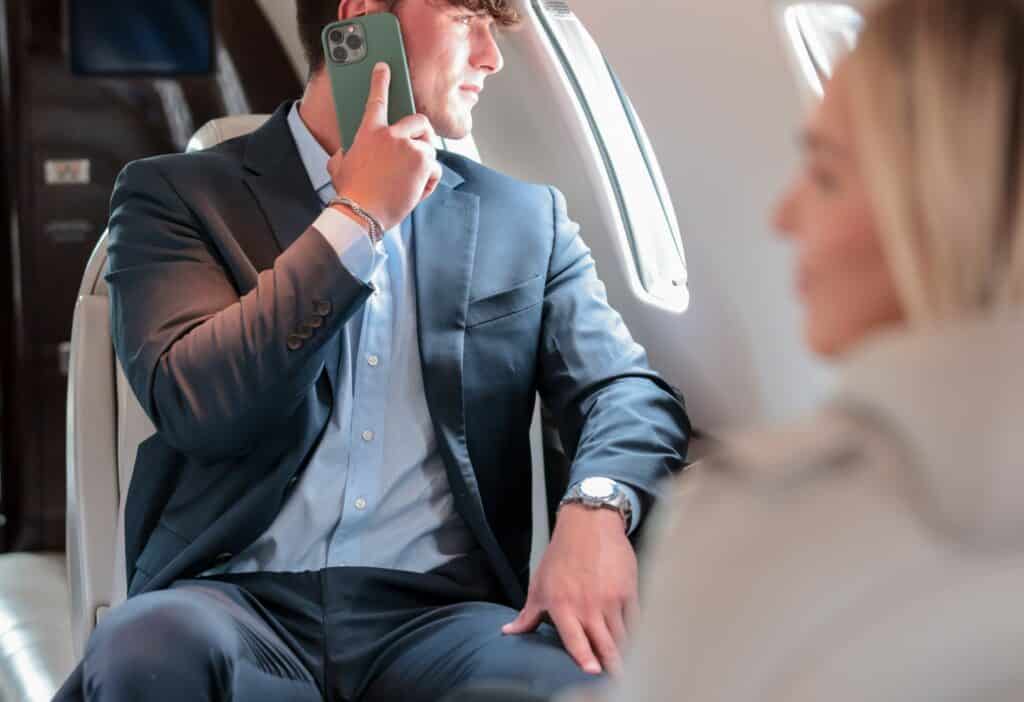 man on phone in aircraft