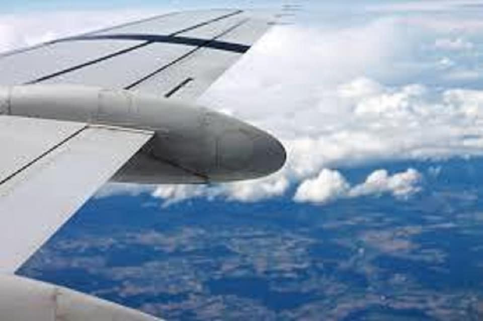 aircraft wing in sky