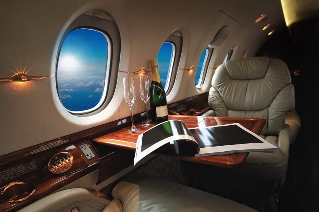interior cabin aircraft at night with champagne