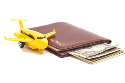 wallet with toy airplane beside